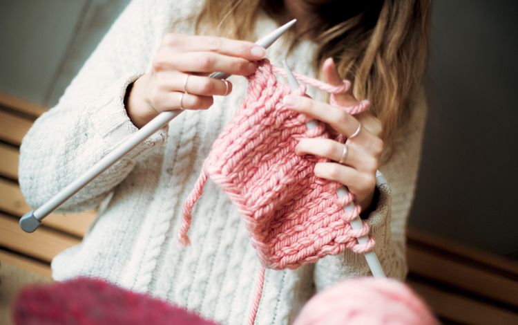 Close up of someone knitting