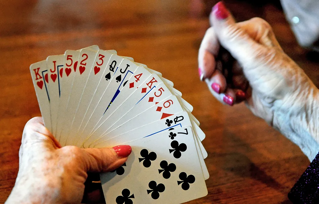 Close up of game of bridge, with a hand of cards